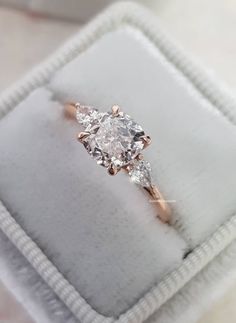 an engagement ring with three diamonds in it