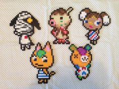 four pixelated animal characters are shown on a white sheet