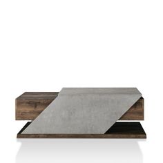 a concrete and wood coffee table sitting on top of a white floor