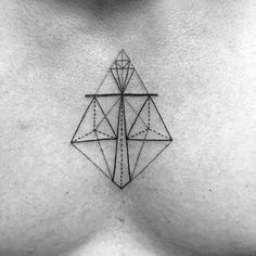 a black and white photo of a woman's chest with an intricate geometric design