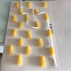 several pieces of food are arranged on a sheet of paper with wires attached to them