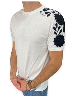 T-shirt for men. Mexican Artisan Product from Chiapas. Embroidered by our artisans Chiapanecas by hand in white or black cotton. Handmade design work with monochrome embroidery pattern Otomi style. Hybrid product with machine-made part and hand embroidery. Material: cotton. Monochrome embroidery by hand. Sizes: small, medium, large and extra large. Primary color: black and white. The availability of colors and sizes is limited. The photos are just a sample of those that are available. Please ask Goth Embroidery, Monochrome Embroidery, Embroidery By Hand, Tshirt Embroidery, Embroidery Men, Traditional Mexican Dress, T Shirt Model, Embroidery Tshirt, Mexican Dresses