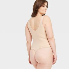 This 4-Way Stretch Tank Bodysuit from Auden™ in a solid color features a sleeveless silhouette with a breezy scoop neckline, cotton gusset for breathability and snap buttons on the crotch. Made from lightweight four-way stretch fabric it offers a comfortable fit that moves with you, and the opaque lining offers confident wear. You can wear this pullover bodysuit with everything from wide-leg trousers to joggers to shorts, and add layering pieces for versatile styling options. Auden™: Comfort tru Sleeveless Beige Bodysuit With Built-in Bra, Seamless Scoop Neck Shapewear For Summer, Summer Sleeveless Shaping Bodysuit, Sleeveless Summer Bodysuit With Medium Bust Support, Sleeveless Beige Lined Bodysuit, Beige Sleeveless Lined Bodysuit, Shaping Sleeveless Beige Bodysuit, Fitted Sleeveless Bodysuit For Daywear, Beige Bodysuit With Medium Bust Support