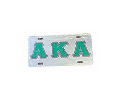 a license plate with the letters aka in pink, green and white on it