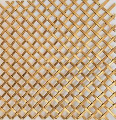 a close up view of a gold woven cloth