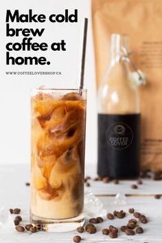 an iced drink with coffee beans on the side and a bag of coffee beans next to it