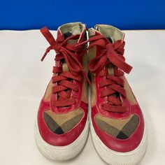 Burberry 'Merrison' Kid's High Top Sneaker - Size 34 Pre Owned, Leather/Canvas Fabrics Are In Good Condition With No Rips Or Tears! Shoes Have Tartan Plaid Design Over Toe Box And Midsole, Along With Large Shoe Laces. Shoes Have High Top Design With Zippers On Side. (Only 1 Functioning Zipper) - High Top Zippers - Material: Leather/Canvas - Color: Red/ Tartan Plaid Burberry High Top Sneakers, Laces Shoes, High Top Sneaker, Red Tartan, Burberry Shoes, Plaid Design, Top Design, Tartan Plaid, Only 1