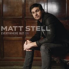 a man sitting on top of a chair next to a wooden wall with the words mattstell everywhere but on