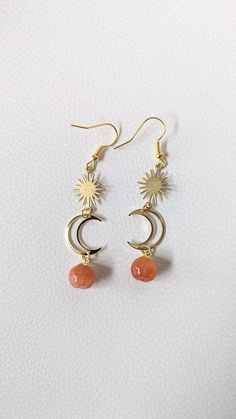 IT'S PUMPKIN SEASON But these little pumpkins are cute enough to wear year round. Lightweight and comfortable, perfect for every day wear. Happy Fall! 🎃🍂 Materials: Half Moon- Gold plated brass * Sun, hooks, and wire - Alloy/copper * Pumpkin - Jade stone, brass loop *Each stone is unique and no two are alike, size and color vary. Length: 2.5" Handcrafted: Each item is carefully assembled by hand to create a high-quality appeal that draws attention. Each item presents unique characteristics and vary by piece, adding to the handmade charm.  Care Instructions: To keep items shining at their best, avoid contact with water, perfume or harsh chemicals. When not in use, store in a dry location to avoid tarnishing. Clean using a dry, non-abrasive cloth.  If you are not satisfied with your purcha Cute Orange Dangle Jewelry, Copper Pumpkins, Pumpkin Colors, Jade Stone, Handmade Charms, Gold Drop Earrings, Happy Fall, Cute Jewelry, Moon