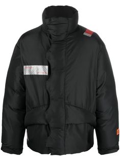 logo-patch padded coat from HERON PRESTON featuring black, padded design, logo patch to the front, logo patch to the rear, concealed front fastening, high neck, long sleeves and straight hem. Man Pad, Heron Preston, Pad Design, Padded Coat, High Neck Long Sleeve, Black Nylon, Black Nylons, Preston, Jet Black