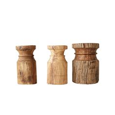 three wooden salt and pepper shakers on a white background