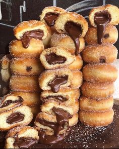 chocolate filled donuts stacked on top of each other