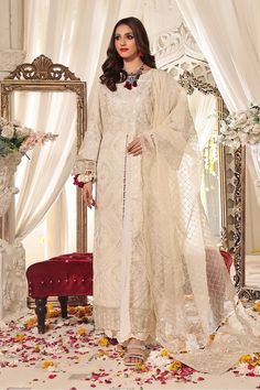 SHIRT STYLE: Long front open Shirt embellished with pearls. FABRIC: Gold Zari Front fully embroidered, Embellished neckline of shirt with embroidered sleeves and back. Color: Cream TROUSER Straight Silk Grip Trouser Color: Cream DUPATTA Embellished Dyed Organza Dupatta