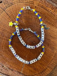 DMB beaded bracelets (set of 2) - You and Me lyrics with charms. Stretchy cord, lobster claw clasp Adjustable Beaded Bracelets With Moon Charm, Adjustable Beaded Bracelet With Lobster Clasp For Festival, Lyric Bracelet, You And Me Lyrics, Eras Bracelets, Artsy Jewelry, Me Lyrics, Dave Matthews Band, Me Too Lyrics