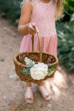 "/ MEET BRISTOL ---------------------- A handmade wicker flower girl basket in natural, peeled willow. Bristol features lush artificial greenery and is accented with a handmade chiffon fabric flower. Inspired by rustic weddings, she's perfect for flower girls of all ages. / ADDITIONAL DETAILS ---------------------- * Basket dimensions: 9\"L x 7\"W x 4.5\"H (10\"H w/ handle) * Sturdy, woven peeled willow basket * Single, fixed handle for easy carrying / THERE'S MORE FOR YOU! --------------------- Willow Wedding, Willow Flower, Flower Girl Basket Rustic, Basket Willow, Greenery Wedding Decor, Willow Basket, Basket Small, Ivory Flower Girl, Flower Girl Baskets