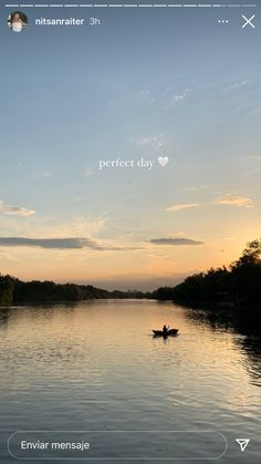 a person in a small boat on a lake at sunset with the caption perfect day