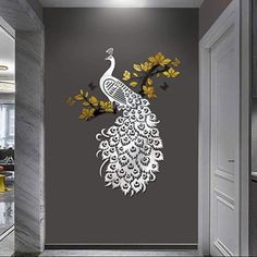 the peacock is sitting on the tree branch wall decal in this hallway, it's decorated with yellow flowers and leaves