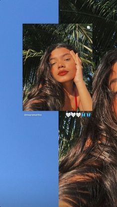 a woman with long brown hair standing in front of palm trees and looking up at the sky