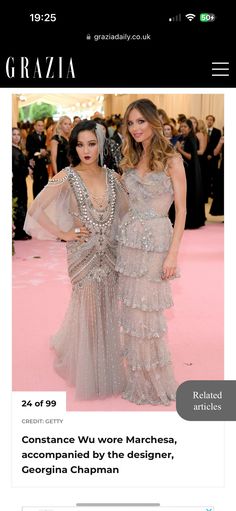 two women standing next to each other in front of a pink carpet with the words grazia on it