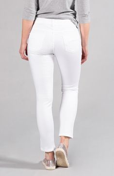 Our customer favorite Audrey in Pure White now has an on-trend distressed feature. Ultra slimming through the hip and thigh but a little roomier in the leg than the everyday skinny. Made with dualFX® Technology by LYCRA®, these super stretch jeans offer unparalleled softness and flexibility while keeping their shape all day, every day. 9" mid-rise, 27.5" inseam, 6" leg opening, based on a size 2 Zip fly with button closure, five-pocket silhouette, tonal stitching dualFX® with LYCRA® (88% Cotton, Trendy Stretch Jeggings With Frayed Hem, White High Rise Stretch Cropped Jeans, White Stretch Cropped Denim Jeans, White Stretch Mid-rise Jeans, White Stretch High Rise Cropped Jeans, White Stretch Cropped Jeans Casual, White Stretch Cropped Jeans Casual Style, Casual White Stretch Cropped Jeans, White Stretch Jeans With Frayed Hem