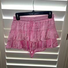 Super Cute Pink Ruffle Mini Skirt!! Vacation Skirt Bottoms With Ruffle Hem, Vacation Skirt With Ruffle Hem, Flowy Short Skirt With Ruffles, Feminine Tiered Skirt Bottoms For Beach, Pink Short Bottoms For Brunch, Feminine Skirted Bottoms For Vacation, Vacation Skirt Shorts With Ruffles, Feminine Mini Skirt For Vacation, Vacation Skirt-style Shorts With Ruffles