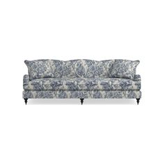 a blue and white couch with floral print on the back, in front of a white background