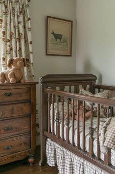 a baby is laying in his crib next to a dresser and window with curtains