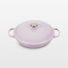 a pink casserole on a white background