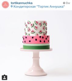 a white cake with watermelon slices on it