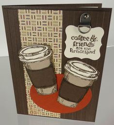 a card with two cups of coffee on it and a tag hanging from the front