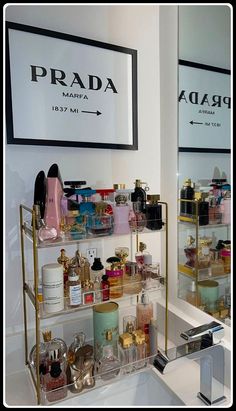 a bathroom sink with two shelves filled with perfumes