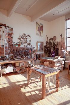 there are many different pictures of woodworking tools in this room, including an old workbench