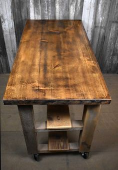 a wooden table sitting on top of a cement floor