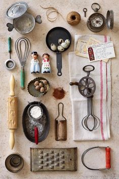 an assortment of kitchen utensils on a table