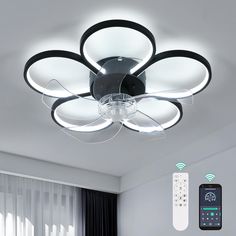 a ceiling light with remote controls on it