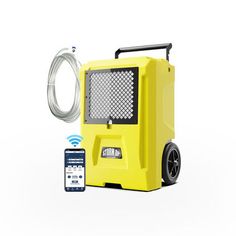 a yellow portable air mover next to an appliance on a white background