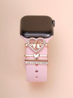 an apple watch with a pink band and heart - shaped buckle on it's strap