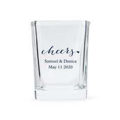 a shot glass with the word cheers printed on it, sitting in front of a white background