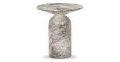 a white marble pedestal with a round top on the bottom and an oval base at the end