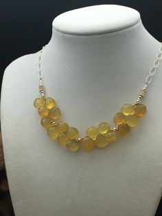 "This necklace is reminiscent of an early spring after a long brutal winter! The beautiful Yellow Chalcedony is light and fresh and pairs nicely with 14k gold fill beads and .925 sterling silver oval chain. There are also AAA+ grade flashy Ethiopian Opals in this necklace. This necklace measures in at 19.5\" but since the chain is on the medium side you can actually adjust the size to smaller if you don't want it to hang as long! Earrings pictured are sold separately. Handcrafted in the U.S.A. b Gold Oval Jewelry With Faceted Beads, Sterling Silver Yellow Gold Wire Wrapped Necklaces, Gold Oval Necklaces With Faceted Beads, Oval Gold Necklaces With Faceted Beads, Gold Oval Necklace With Faceted Beads, Gold Teardrop Necklace With Polished Beads, Unique Gold Faceted Necklaces, Opal Necklace Silver, Kyanite Earrings