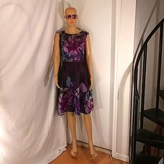 Nwot Tahari Sleeveless Purple A-Line Floral Print Semi Sheer Lined Dress Size 6. This Stunning Classic & Uniquely Designed Dress Features A Semi Sheer Purple Multi Color Floral Print With A Built In Purple Lining That Separates Below The Waist Giving A Silhouette Appearance And Special Visual Affect. A Beautiful Dress For Those Special Occasions. Fitted Purple Sleeveless Dress For Spring, Purple Sleeveless Mini Dress For Spring, Purple Sleeveless Midi Dress For Spring, Purple A-line Sleeveless Dress For Spring, Purple Line, Tahari Dress, Beautiful Dress, Floral Print Dress, Blue Purple