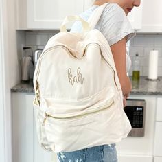 "Our Monogrammed June Nylon Backpack combines functionality, style, and personalization to create the perfect day bag for yourself or your kids! Crafted with meticulous attention to detail, this backpack is designed to be your go-to companion for school, work, or any adventure that comes your way. Constructed from durable nylon material, this backpack is built to withstand the demands of everyday use. Its spacious interior provides ample room to store textbooks, notebooks, laptops, and other ess Monogram Backpack, Stylish Backpack, Weekend Travel, Elegant Bags, Stylish Backpacks, Bachelorette Gifts, Metal Accents, Loungewear Sets, Weekender Tote