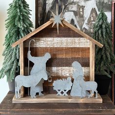 a nativity scene is displayed on a mantle