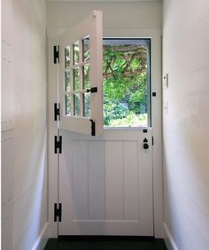 an open door leading into a white room with the words, how to install a barn door hardware