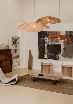 a living room filled with furniture and art