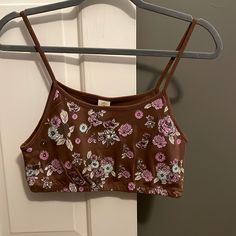 Nwt! Fitted And Cropped Tank With Spaghetti Straps- Brown With Floral Design From Urban Outfitters. Brown Spaghetti Strap Tops For Spring, Spring Brown Spaghetti Strap Tops, Brown Camisole Crop Top For Summer, Brown Tops With Adjustable Straps For Summer, Brown Top With Built-in Bra For Spring, Summer Brown Cami Crop Top, Brown Cami Crop Top For Summer, Urban Outfitters Brown Crop Top For Spring, Urban Outfitters Summer Tops With Built-in Bra