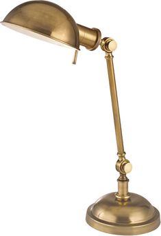 an antique brass desk lamp on a white background