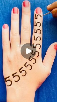 someone has their hand painted with numbers and the word 55355 is written on it