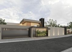 a modern house with two garages on the street