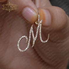 "Pave Diamond Initial Pendant, 14K Solid Gold M Initial Pendant, Diamond M Initial Pendant, Yellow Gold Diamond Initial Pendant, M Initial ★ Item - Diamond \" Cursive M \" Initial Pendant ★ SKU - PEMJ-1803 ✔ Made to Order ✔ Metal; 14k Solid Gold ✔ Item Color: Yellow Gold ✔ Pendant Size: 15x10MM Initial with Diamond Bail/Loop - 22MM (Approximate) ▶ Diamond Details ✔ Gemstone: Genuine White Diamond ✔ Gemstone Cut: Round ✔ Number of Stones: 74 ✔ Stone Size: 1 mm ✔ Diamond CTW: 0.35 CT Approx. ✔ Diamond Color Clarity: H Color SI Clarity ★ Notes : ✔ Don't forget to hit the favorite button in order to track the item on your favorites/wish list. ✔ Please kindly leave your phone number at checkout for delivery purposes. ♦ Other finishes and styles are available in our store! Message us for any cus M Diamond Pendant, M Initial Pendant, Cursive M, M Initial, Gold Initial Pendant, Pendant Diamond, Diamond Gift, Monogram Jewelry, Diamond Chain